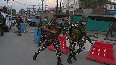 Security personnel arrive near the site where a man was shot dead by unknown gunmen in the Karanagar area of Srinagar on Saturday. (AFP)