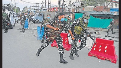 Security personnel near the site where the man was shot dead in Srinagar on Saturday. (AFP)