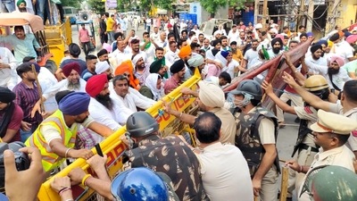 Farmers clash with police personnel during a protest in Karnal on Saturday. (ANI Photo) Farmers clash with police personnel during a protest in Karnal on Saturday. (ANI Photo)