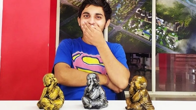 Akash Singh with sculptures made out of temple waste (Life Beyond Numbers)