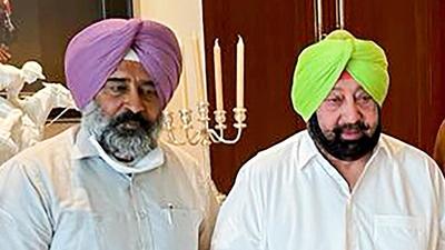 A file photo of Punjab sports and education minister Pargat Singh with Captain Amarinder Singh. (PTI) A file photo of Punjab sports and education minister Pargat Singh with Captain Amarinder Singh. (PTI)