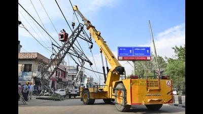 The electricity tower being repaired on Gill Road in Ludhiana on Thursday.