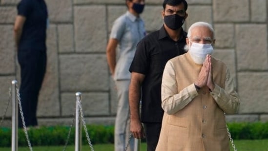 Indian Prime Minister Narendra Modi, greets as he arrives to pay tribute to iconic independence leader Mahatma Gandhi on his birth anniversary at Rajghat, the Gandhi memorial, in New Delhi on October 2.(AP)