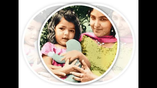 In her mother’s arms when she was a toddler In her mother’s arms when she was a toddler