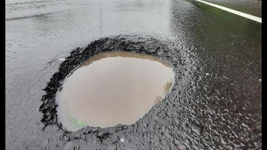 The Navi Mumbai unit of MNS has threatened to name potholes in the city after the civic officials if they are not repaired in a couple of days. (HT PHOTO)