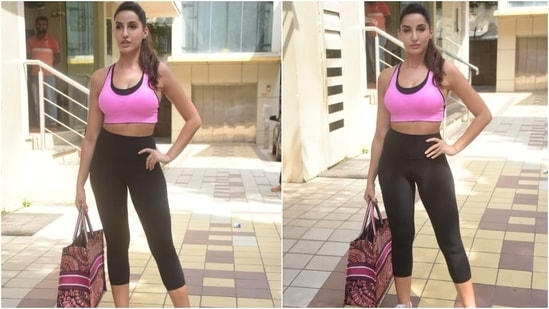 To complete the gym look, Nora tied her locks in a sleek ponytail. She accessorised her outfit with small ear studs and chose nude pink lip shade and glowing skin as her beauty pick.&nbsp;(HT Photo/Varinder Chawla)