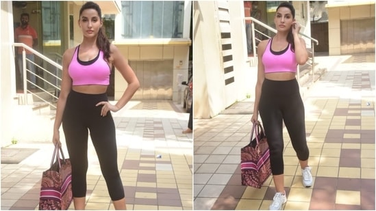 Flaunting her toned midriff, Nora teamed the sports bra with a pair of black calf-length leggings and white lace-up sneakers.&nbsp;(HT Photo/Varinder Chawla)