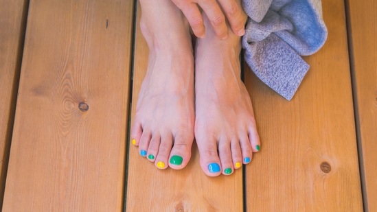 Powder Your Toes: Powdering your toes with baby powder will help absorb all the moisture from your toes. You can also go for moisture-wicking sock.(Unsplash)