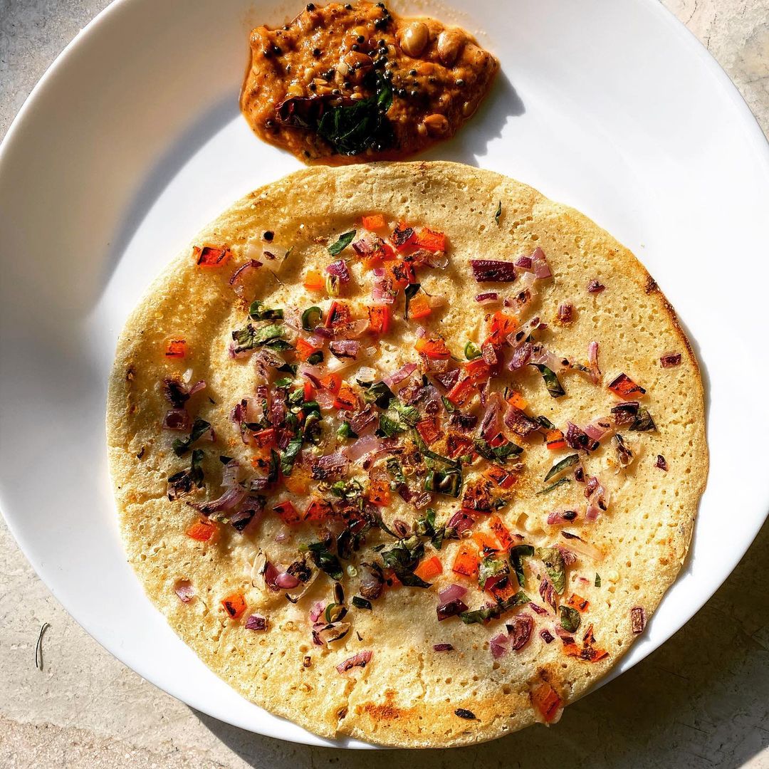 Millet Uttapam (For representation purpose only). (Instagram/@sareesandsourdough) Millet Uttapam (For representation purpose only). (Instagram/@sareesandsourdough)
