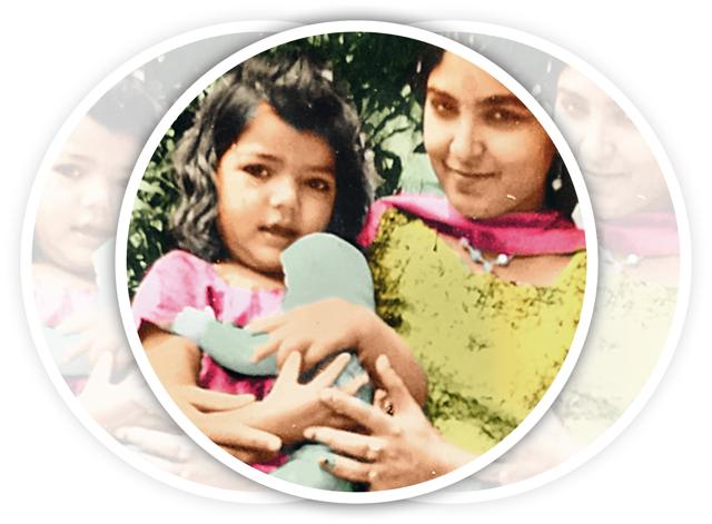 In her mother’s arms when she was a toddler In her mother’s arms when she was a toddler