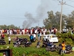 A vehicle set ablaze after violence broke out after farmers agitating were allegedly run over by a vehicle in the convoy of a union minister, in Lakhimpur Kheri.(PTI) A vehicle set ablaze after violence broke out after farmers agitating were allegedly run over by a vehicle in the convoy of a union minister, in Lakhimpur Kheri.(PTI)