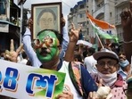 Trinamool Congress supporters celebrate near CM Mamata Banerjee's residence in Kolkata on Sunday. (Samir Jana/HT Photo)