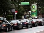 Vehicles queue to refill at a BP fuel station in London, Britain, on Saturday. (Reuters/Henry Nicholls)