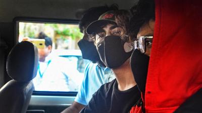 Bollywood actor Shah Rukh Khan's son Aryan Khan being taken for his medical examination by NCB officials in connection an alleged drugs case in Mumbai on Sunday. (PTI)