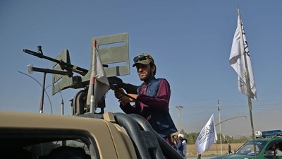 A Taliban fighter stands guard in a vehicle near the venue of an open-air rally in a field on the outskirts of Kabul on October 3, 2021. (AFP) A Taliban fighter stands guard in a vehicle near the venue of an open-air rally in a field on the outskirts of Kabul on October 3, 2021. (AFP)