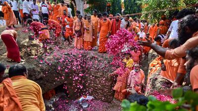 Akhara Sadhus perform a ritual during 'Bhoo Samadhi' of mortal remains of the Akhil Bharatiya Akhara Parishad president Mahant Narendra Giri Maharaj, who was found dead in mysterious conditions, at Baghambari Gaddi Math in Prayagraj. (PTI) Akhara Sadhus perform a ritual during 'Bhoo Samadhi' of mortal remains of the Akhil Bharatiya Akhara Parishad president Mahant Narendra Giri Maharaj, who was found dead in mysterious conditions, at Baghambari Gaddi Math in Prayagraj. (PTI)