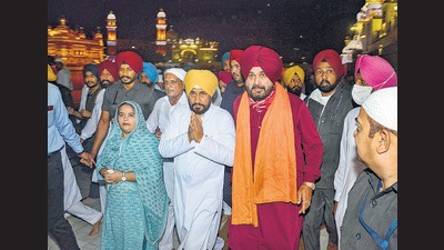 CM Charanjit Singh Channi with Punjab Congress chief Navjot Singh Sidhu, in Amritsar on Sept 22. (PTI) CM Charanjit Singh Channi with Punjab Congress chief Navjot Singh Sidhu, in Amritsar on Sept 22. (PTI)
