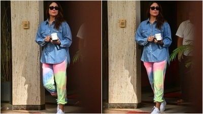 Kareena chose a simple collared denim button-down shirt with long sleeves. She teamed it with colourful tie-dye joggers in different shades of blue, pink, lemon yellow and orange. The pants featured a gathered hem and a fitted silhouette. (HT Photo/Varinder Chawla)
