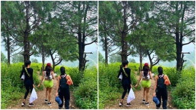 Janhvi added a red cap to her look and the splash of colours are the cues for fashion lovers to start taking notes. The actor and her friends walked through nature with their travel accessories in hand. (Instagram/@janhvikapoor)