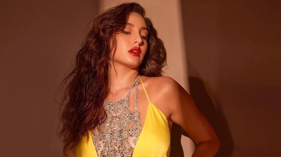 Nora Fatehi cuts a sensuous silhouette in <span class='webrupee'>?</span>40.5k yellow wrap dress with straps(Instagram/norafatehi)