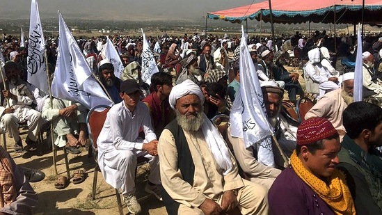 Taliban supporters attend an open air rally in a field in Kabul on October 3, 2021. (Photo by Hoshang HASHIMI / AFP) (AFP)