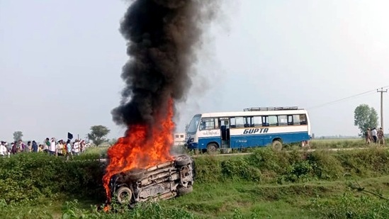A vehicle set ablaze in Lakhimpur Kheri on Sunday.(ANI)