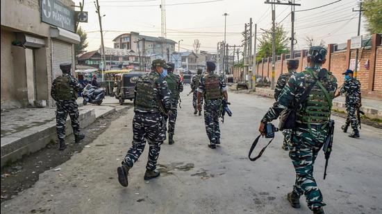 Security personnel preparing for a search operation after a civilian was killed in a shopping complex allegedly by terrorists in Karan Nagar, in Srinagar, Saturday. (PTI) Security personnel preparing for a search operation after a civilian was killed in a shopping complex allegedly by terrorists in Karan Nagar, in Srinagar, Saturday. (PTI)