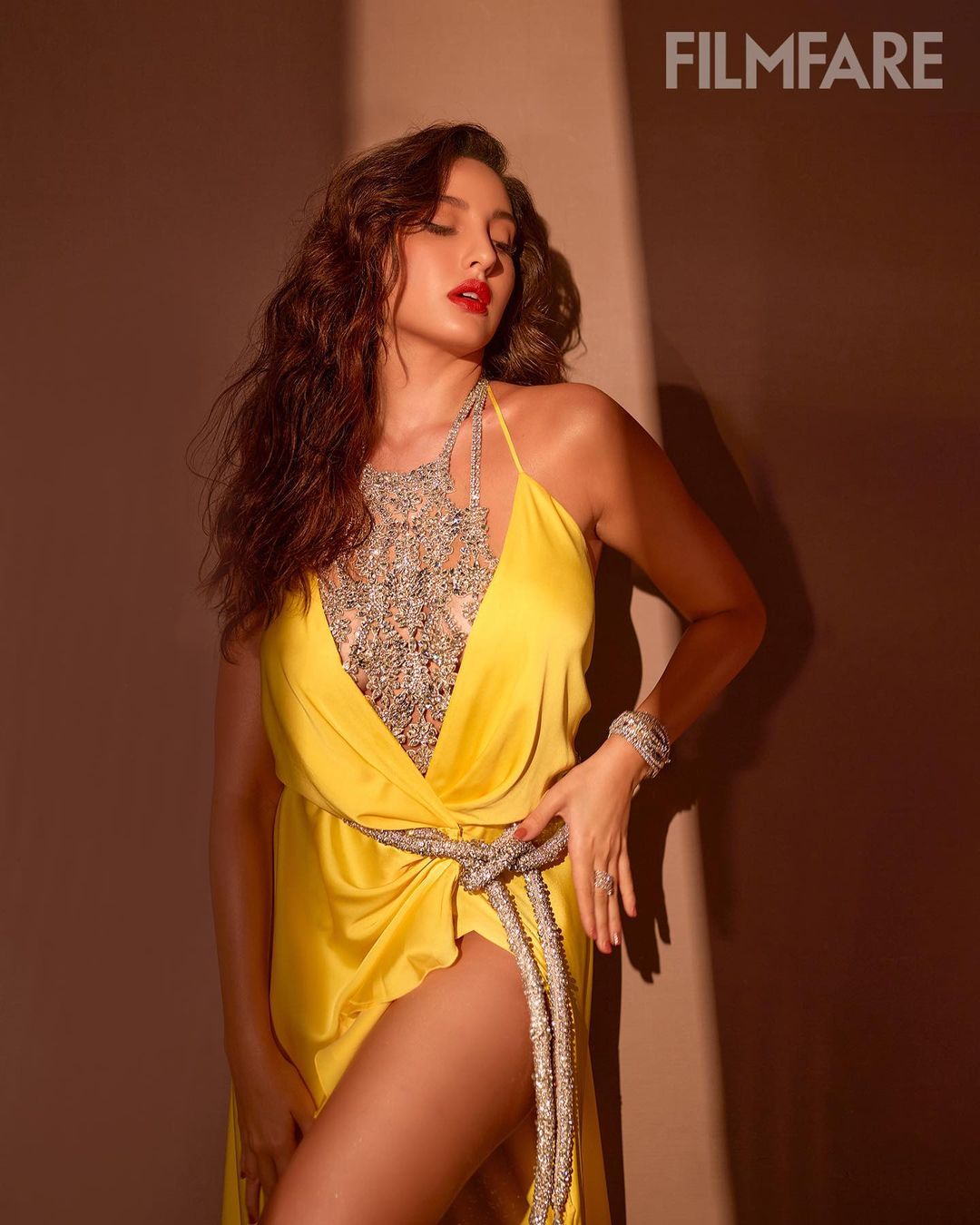 Nora Fatehi cuts a sensuous silhouette in 40.5k yellow wrap dress with straps | Fashion Trends Nora Fatehi cuts a sensuous silhouette in 40.5k yellow wrap dress with straps | Fashion Trends