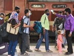 A BMC health worker checks temperatures before Covid-19 test of passengers arriving on outstation trains at Dadar station, in Mumbai( Satish Bate/Hindustan Times) A BMC health worker checks temperatures before Covid-19 test of passengers arriving on outstation trains at Dadar station, in Mumbai( Satish Bate/Hindustan Times)
