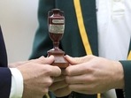 England captain Joe Root, left, and Australia's captain Tim Paine pose with the Ashes urn: File photo(AP) England captain Joe Root, left, and Australia's captain Tim Paine pose with the Ashes urn: File photo(AP)