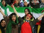 Iranian women cheer during the World Cup Qatar 2022 Group C qualification football match between Iran and Cambodia at the Azadi stadium in the capital Tehran in October 2019. (Photo by Atta Kenare/AFP) Iranian women cheer during the World Cup Qatar 2022 Group C qualification football match between Iran and Cambodia at the Azadi stadium in the capital Tehran in October 2019. (Photo by Atta Kenare/AFP)