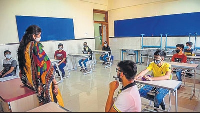 A teacher interacts with students in a classroom at DG Khetan International School, Malad, on Monday after schools reopen for physical classes. (Pratik Chorge/HT PHOTO) A teacher interacts with students in a classroom at DG Khetan International School, Malad, on Monday after schools reopen for physical classes. (Pratik Chorge/HT PHOTO)