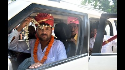 Congress leader Haseeb Ahmad dressed as a groom in a car with fellow Congressmen posing as baaratis in Prayagraj on Monday. (HT photo)