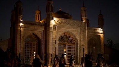 Taliban fighters walk at the entrance of the Eid Gah Mosque after an explosion in Kabul, Afghanistan, Sunday, Oct. 3, 2021. (AP) Taliban fighters walk at the entrance of the Eid Gah Mosque after an explosion in Kabul, Afghanistan, Sunday, Oct. 3, 2021. (AP)