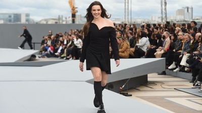 Australian actress Katherine Langford wears a black asymmetric neckline dress with chunky shoes as she walks for L'Oreal at the ongoing Paris Fashion Week. (AFP) Australian actress Katherine Langford wears a black asymmetric neckline dress with chunky shoes as she walks for L'Oreal at the ongoing Paris Fashion Week. (AFP)