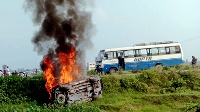 A vehicle is set ablaze after violence broke out following a farmers' protest in Lakhimpur Kheri. (PTI Photo) A vehicle is set ablaze after violence broke out following a farmers' protest in Lakhimpur Kheri. (PTI Photo)