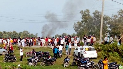 A vehicle set ablaze after violence broke out after farmers agitating were allegedly run over by a vehicle in the convoy of a union minister, in Lakhimpur Kheri (PTI)