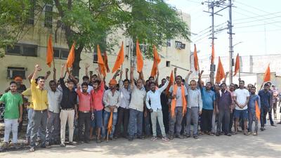 The sacked factory workers staging a protest against the private auto-parts manufacturing factory in Ludhiana on Monday. (Gurpreet Singh/HT)