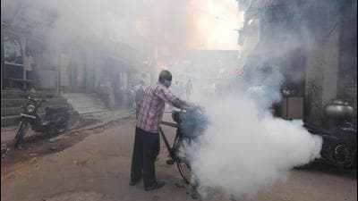 A civic employee fumigates a road in the capital. Dengue cases in Delhi usually peak around October. (Raj K Raj/HT Photo) A civic employee fumigates a road in the capital. Dengue cases in Delhi usually peak around October. (Raj K Raj/HT Photo)