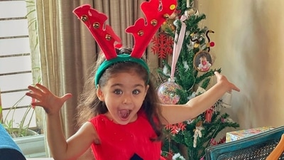 Inaaya Naumi Kemmu enjoying Christmas in her cute red dress and reindeer hairband. Inaaya Naumi Kemmu enjoying Christmas in her cute red dress and reindeer hairband.