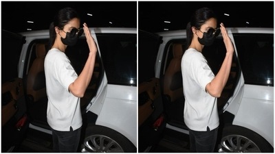 The actor posed for the paparazzi before getting into her car. She tied her hair back with a middle part, into a clean ponytail. Katrina waved for the cameras.&nbsp; (HT Photos/Varinder Chawla)