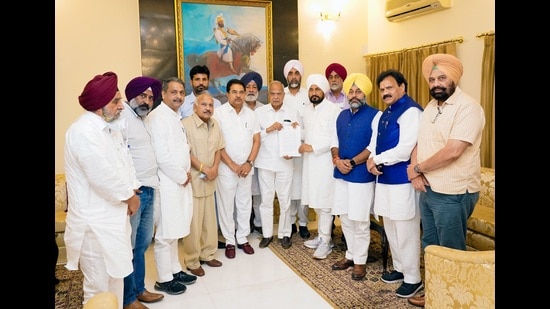 Punjab chief minister Charanjit Singh Channi along and his cabinet colleagues with governor Banwarilal Purohit after submitting a memorandum addressed to the Prime Minister in Chandigarh on Monday.