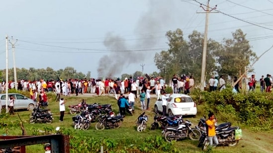 A vehicle set ablaze after violence broke out after farmers agitating were allegedly run over by a vehicle in the convoy of a union minister in Lakhimpur Kheri.(PTI) A vehicle set ablaze after violence broke out after farmers agitating were allegedly run over by a vehicle in the convoy of a union minister in Lakhimpur Kheri.