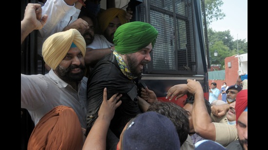 Punjab Congress president Navjot Sidhu along with party MLAs and workers being detained by police during a protest against the Lakhimpur Kheri incident outside the Punjab Raj Bhawan in Chandigarh on Monday.
