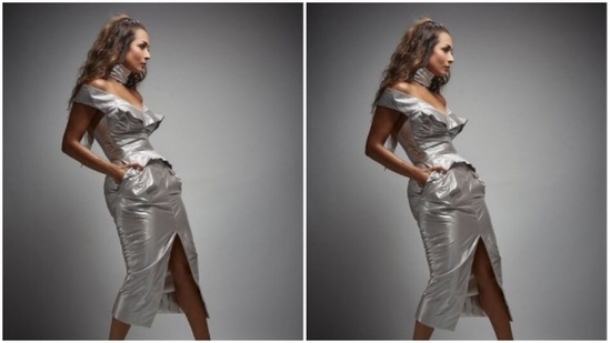 For footwear, Malaika threw in a pair of matching metallic silver stilettoes. The actor posed in her silver ensemble from a side and gave us a glimpse of how stunning she looks.(Instagram/@manekaharisinghani)