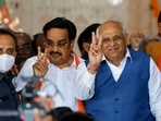 Gujarat chief minister Bhupendra Patel and state BJP president CR Paatil show victory sign after winning the party's victory in Gandhinagar Municipal Corporation election on Tuesday.(PTI Photo) Gujarat chief minister Bhupendra Patel and state BJP president CR Paatil show victory sign after winning the party's victory in Gandhinagar Municipal Corporation election on Tuesday.(PTI Photo)