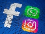 Facebook, WhatsApp and Instagram logos are displayed through broken glass in this illustration.(Reuters Photo)
