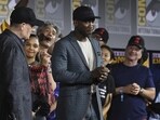 Mahershala Ali, centre, wears a hat to promote his new movie Blade at the Marvel Studios panel on day three of Comic-Con International on July 20, 2019, in San Diego.(Chris Pizzello/Invision/AP)