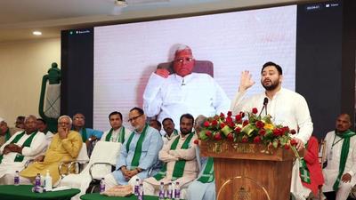 RJD leader Tejashwi Yadav addresses a training camp in Patna on Tuesday. Party chief Lalu Prasad also seen virtually. (ANI)