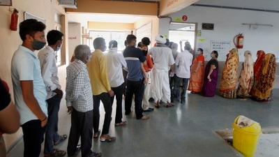 Voters stand in a queue to cast their votes during the Gandhinagar Municipal Corporation elections, on Sunday. (PTI Photo) Voters stand in a queue to cast their votes during the Gandhinagar Municipal Corporation elections, on Sunday. (PTI Photo)